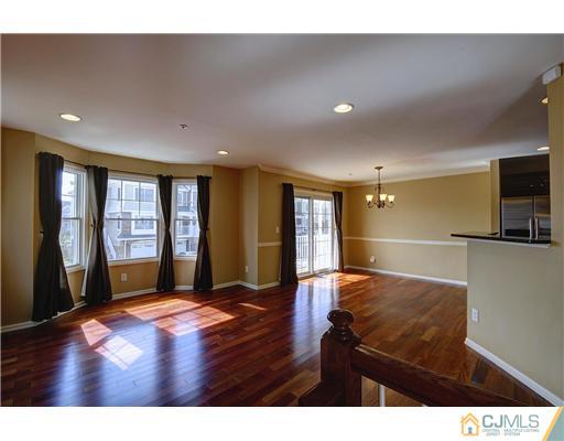 54 Raritan Reach Road South Amboy, NJ 08879 - Photo 6 of 23 a open hall with furniture and wooden floor