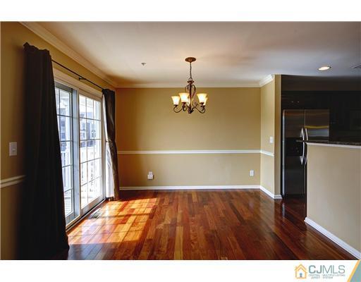 54 Raritan Reach Road South Amboy, NJ 08879 - Photo 8 of 23 a view of empty room with wooden floor and fan