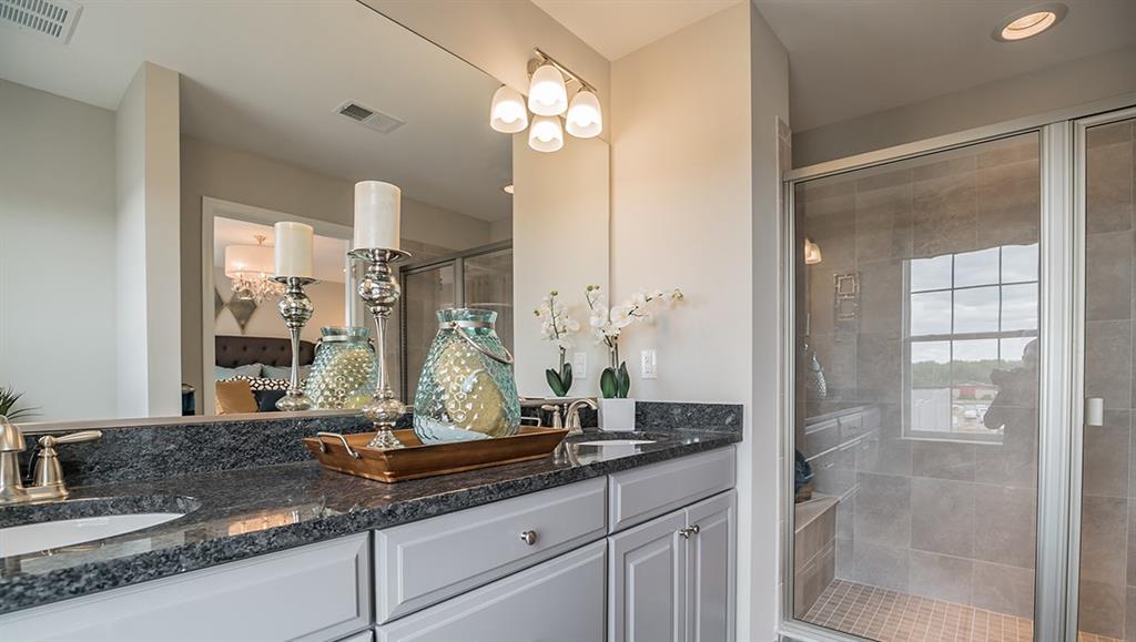 1402 Hights Farm Road South Raleigh, NC 27603 - Photo 2 of 25 a bathroom with double vanity and a mirror