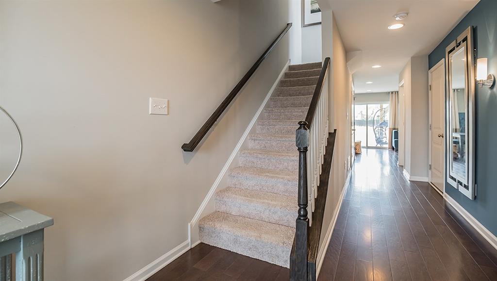 1402 Hights Farm Road South Raleigh, NC 27603 - Photo 21 of 25 a view of a hallway with wooden floor and staircase