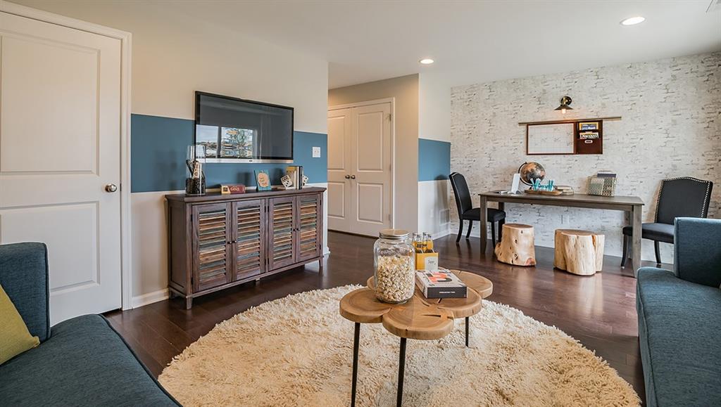 1402 Hights Farm Road South Raleigh, NC 27603 - Photo 7 of 25 a bed room with furniture and wooden floor