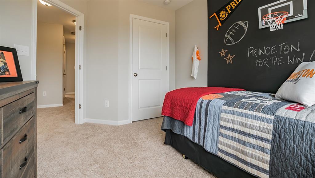 1402 Hights Farm Road South Raleigh, NC 27603 - Photo 9 of 25 a bedroom with a bed and a window