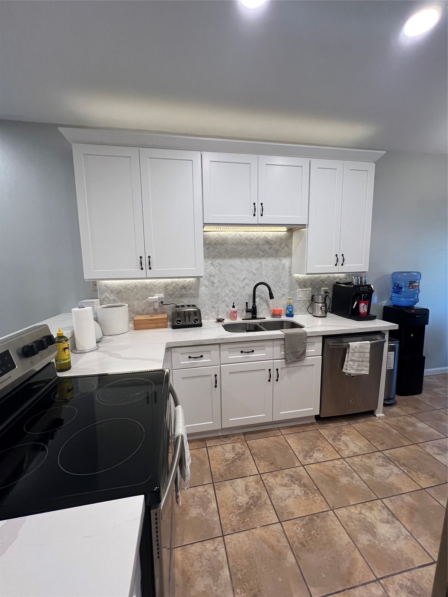 2414 Longview Street, Unit 202 Austin, TX 78705 - Photo 6 of 17 a kitchen with a sink a stove and cabinets