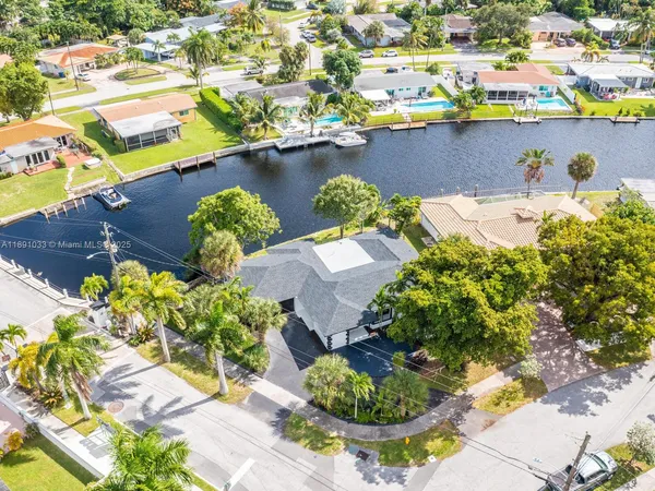 a view of a lake with a house in the background