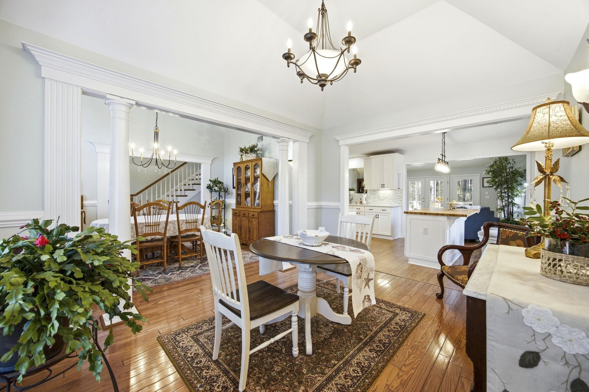 1301 Regent Terrace North Surfside Beach, SC 29575 - Photo 19 of 40 Dining area featuring a chandelier, light wood-style floors, and lofted ceiling