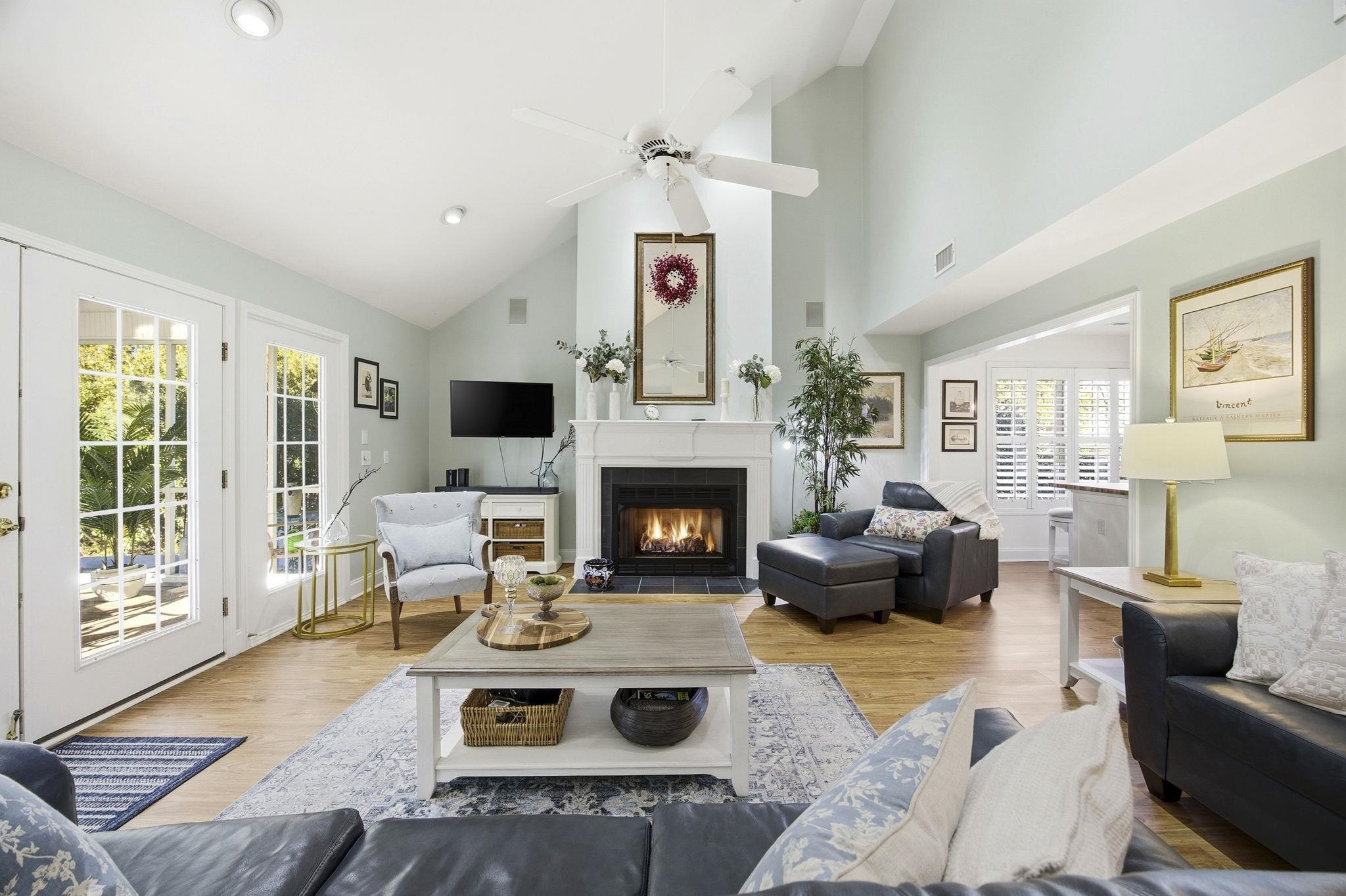 1301 Regent Terrace North Surfside Beach, SC 29575 - Photo 2 of 40 Living room featuring high vaulted ceiling, a fireplace with flush hearth, wood finished floors, and ceiling fan