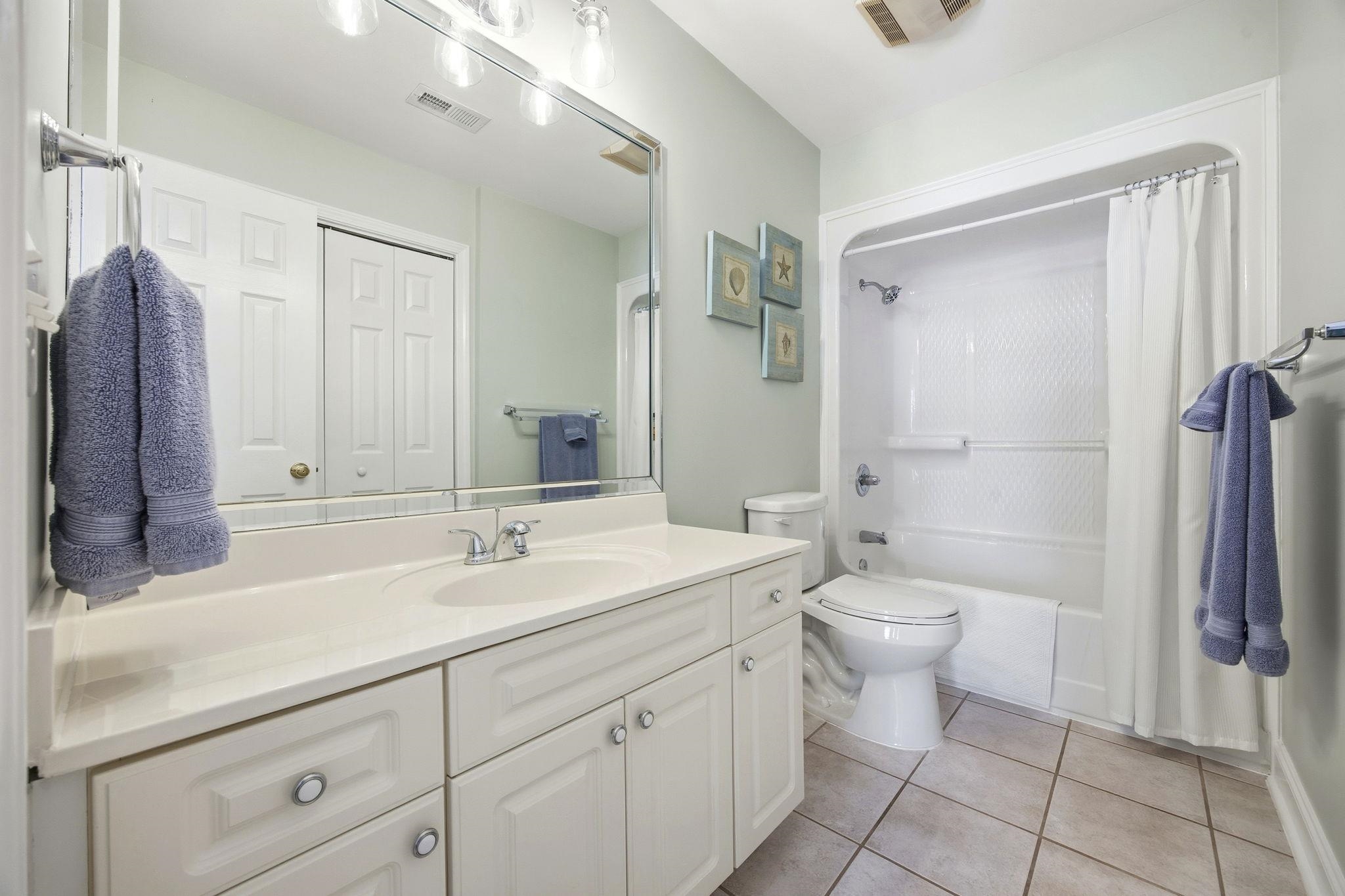 1301 Regent Terrace North Surfside Beach, SC 29575 - Photo 30 of 40 Bathroom with vanity, shower / bath combination with curtain, and light tile patterned floors