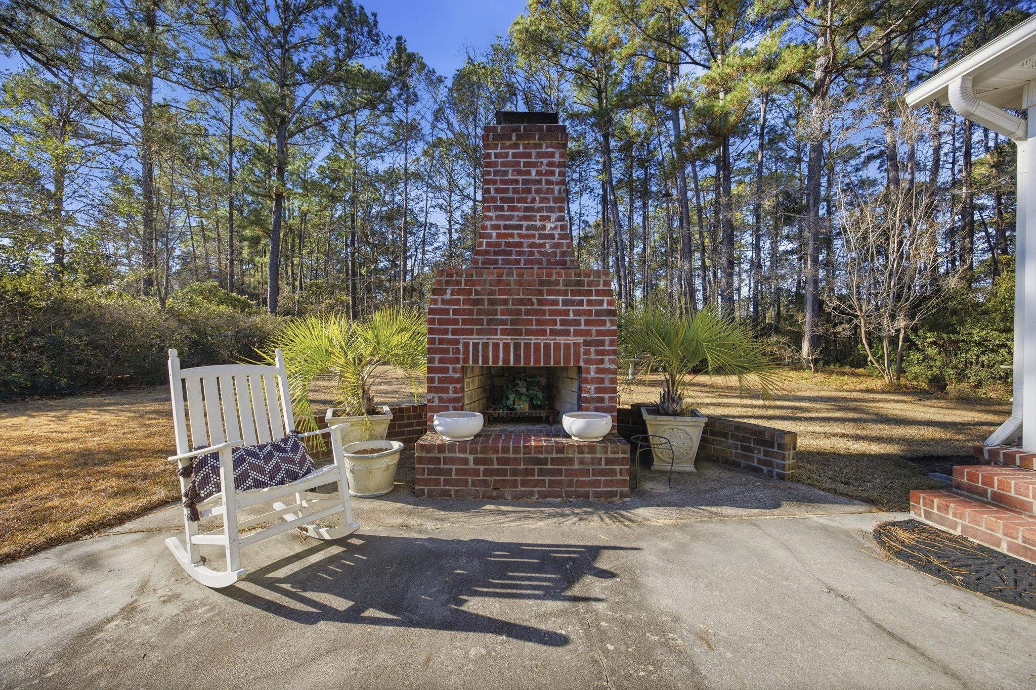 1301 Regent Terrace North Surfside Beach, SC 29575 - Photo 34 of 40 View of patio featuring an outdoor brick fireplace