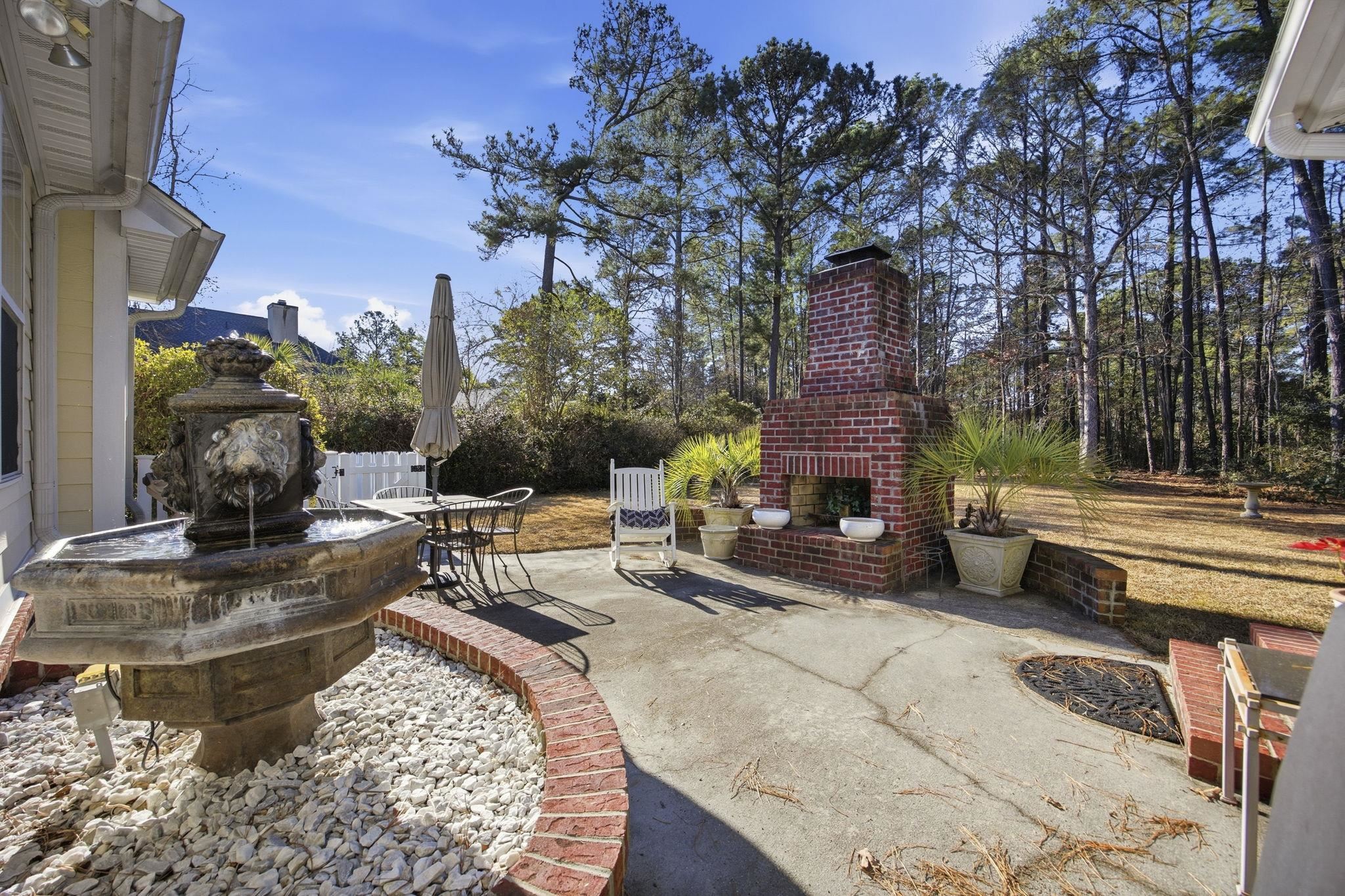 1301 Regent Terrace North Surfside Beach, SC 29575 - Photo 5 of 40 View of patio / terrace with an outdoor brick fireplace
