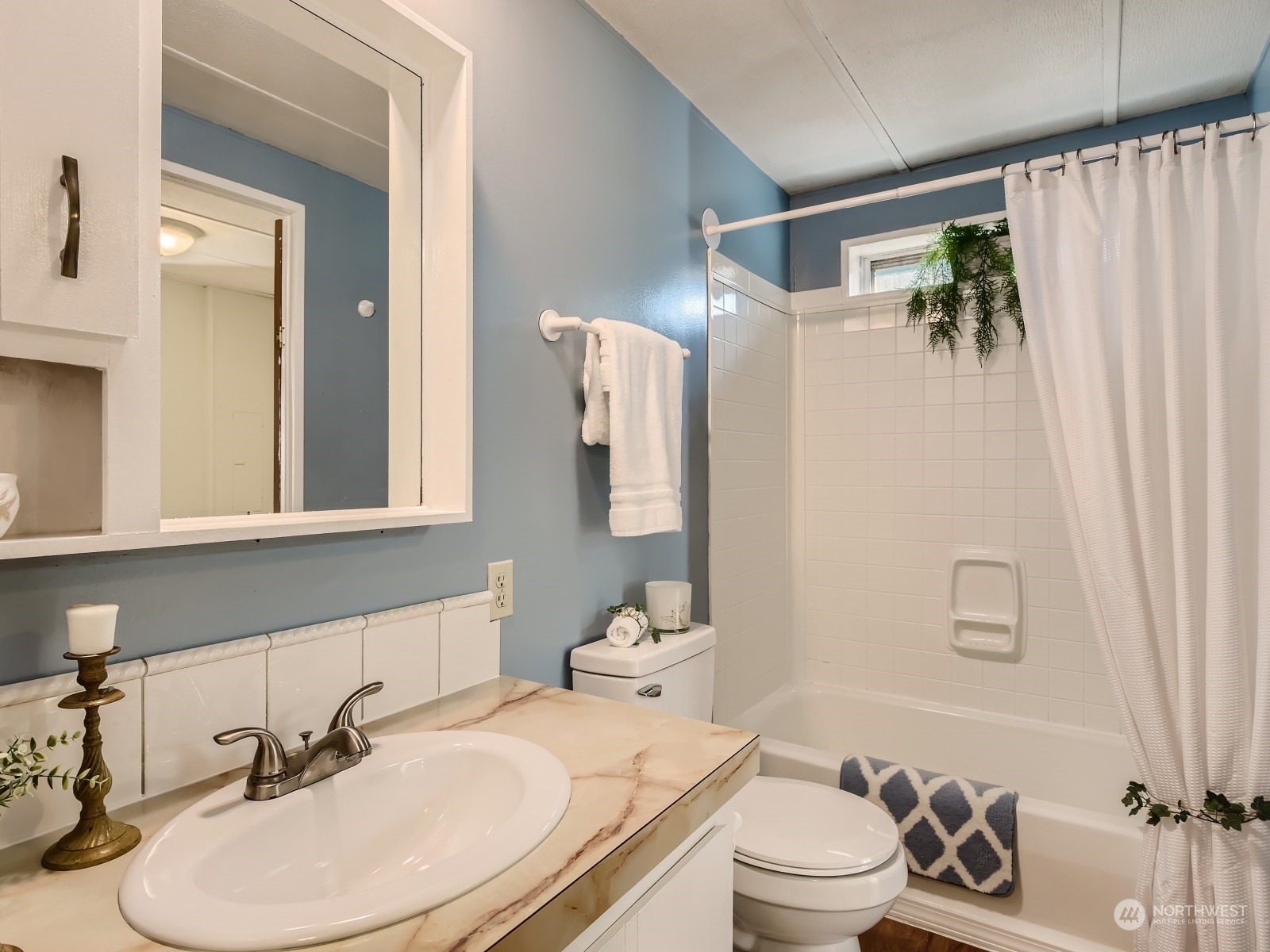 20614 West Richmond Road Bothell, WA 98021 - Photo 16 of 24 a bathroom with a sink toilet and shower