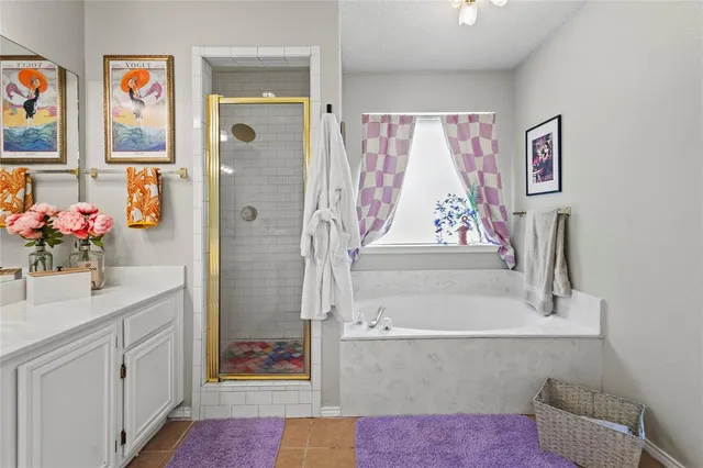 a bathroom with a sink mirror and a bath tub