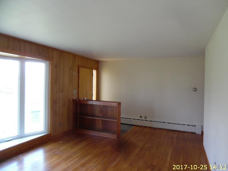 731 Point Phillips Road Bath, PA 18014 - Photo 6 of 22 an empty room with wooden floor and windows