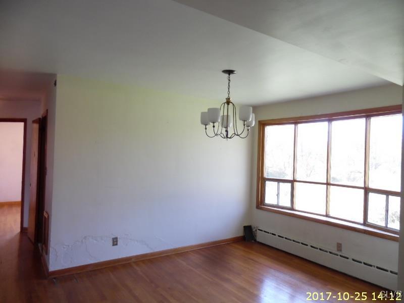 731 Point Phillips Road Bath, PA 18014 - Photo 9 of 22 an empty room with wooden floor and windows