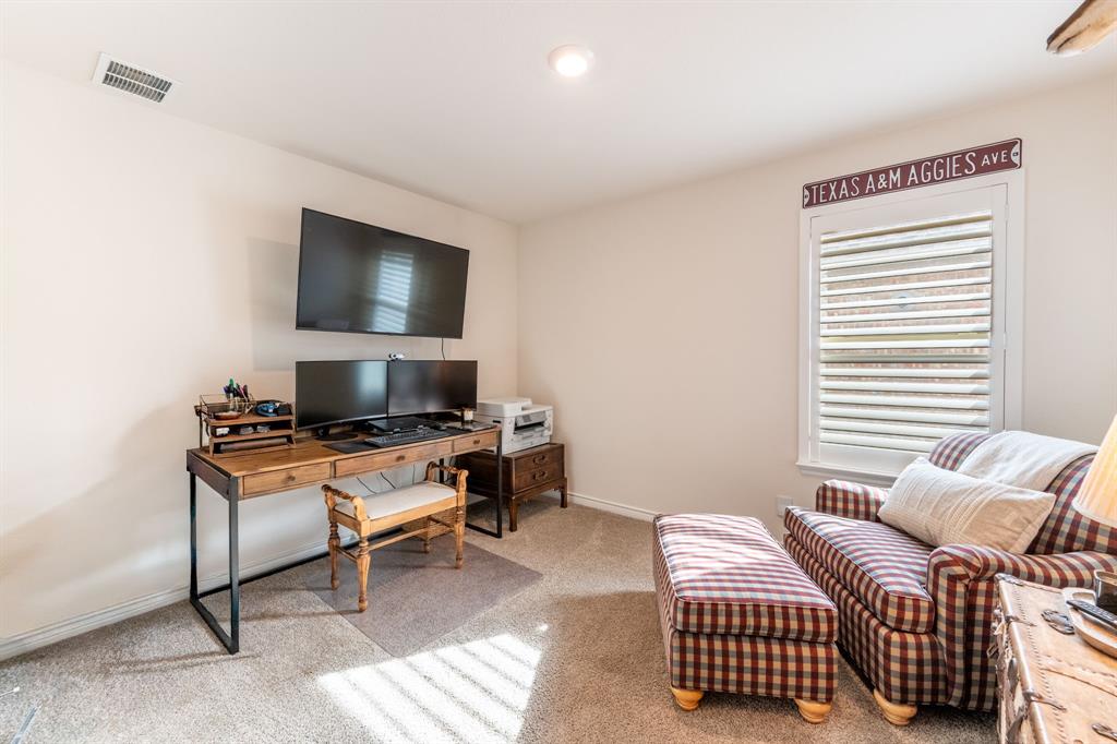 224 Wakefield Road Fate, TX 75189 - Photo 23 of 30 a living room with furniture and a flat screen tv