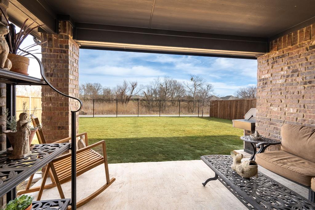 224 Wakefield Road Fate, TX 75189 - Photo 26 of 30 a view of a two chairs in the patio