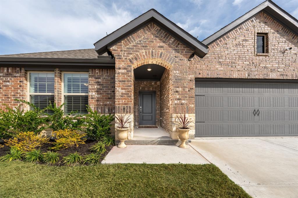 224 Wakefield Road Fate, TX 75189 - Photo 3 of 30 a front view of a house with garden