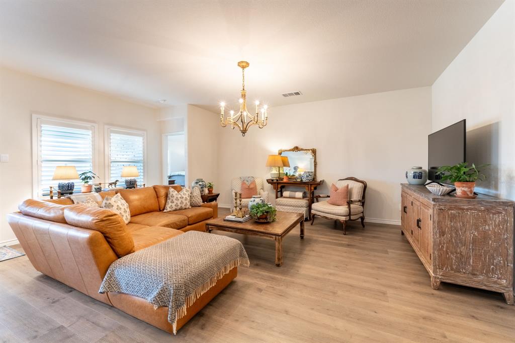 224 Wakefield Road Fate, TX 75189 - Photo 7 of 30 a living room with furniture and a flat screen tv