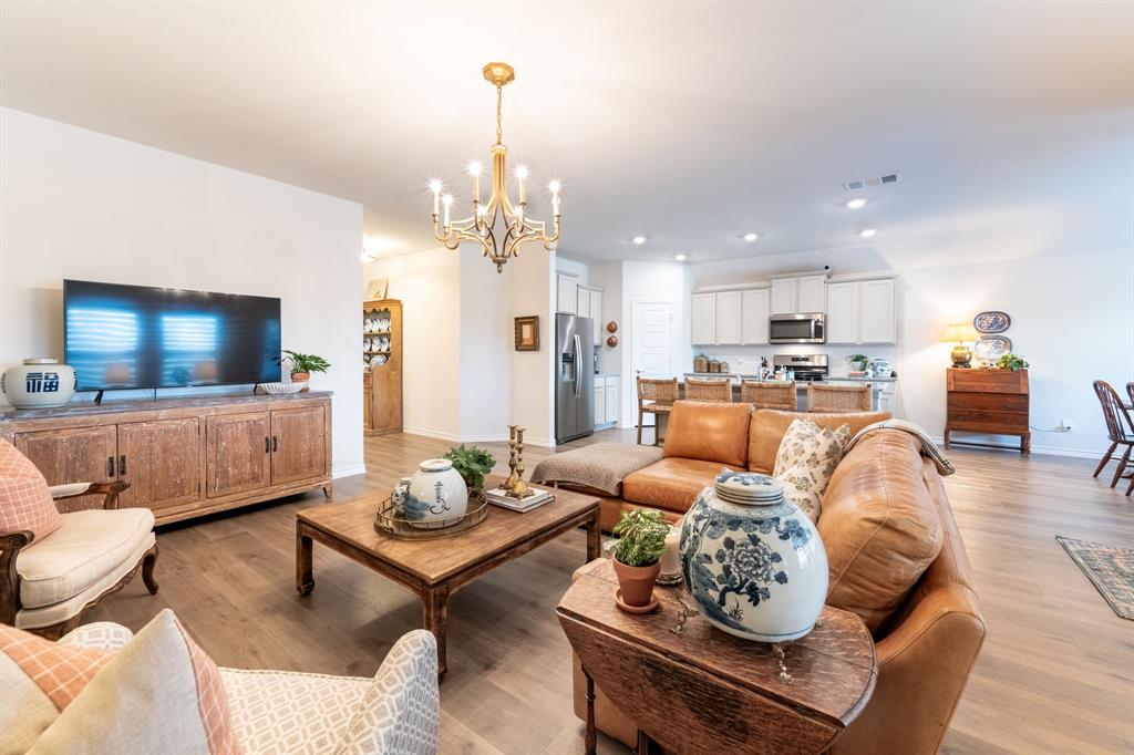 224 Wakefield Road Fate, TX 75189 - Photo 9 of 30 a living room with furniture and a flat screen tv