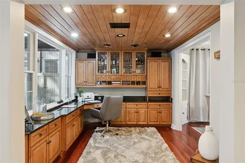 a bedroom with a workspace