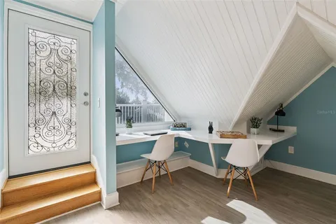 an aerial view of a house with a outdoor space