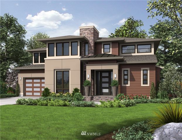 a front view of a house with a garden and plants