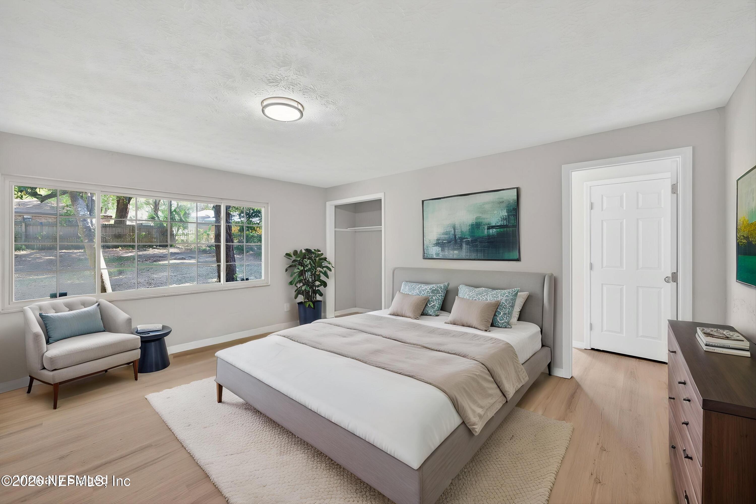 6894 Ridge Street Keystone Heights, FL 32656 - Photo 19 of 40 a bedroom with a bed and a couch