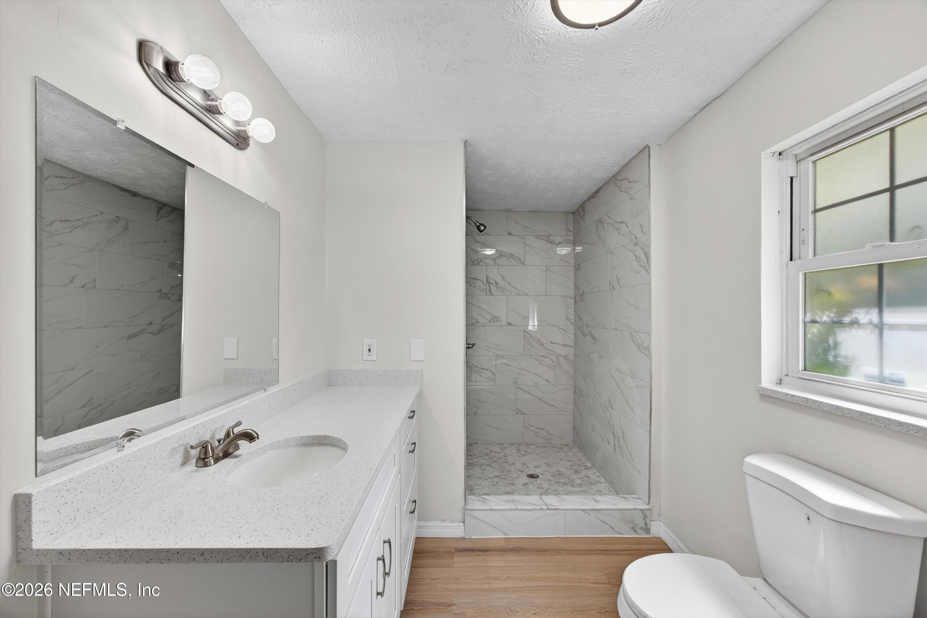 6894 Ridge Street Keystone Heights, FL 32656 - Photo 24 of 40 a bathroom with a sink toilet and shower