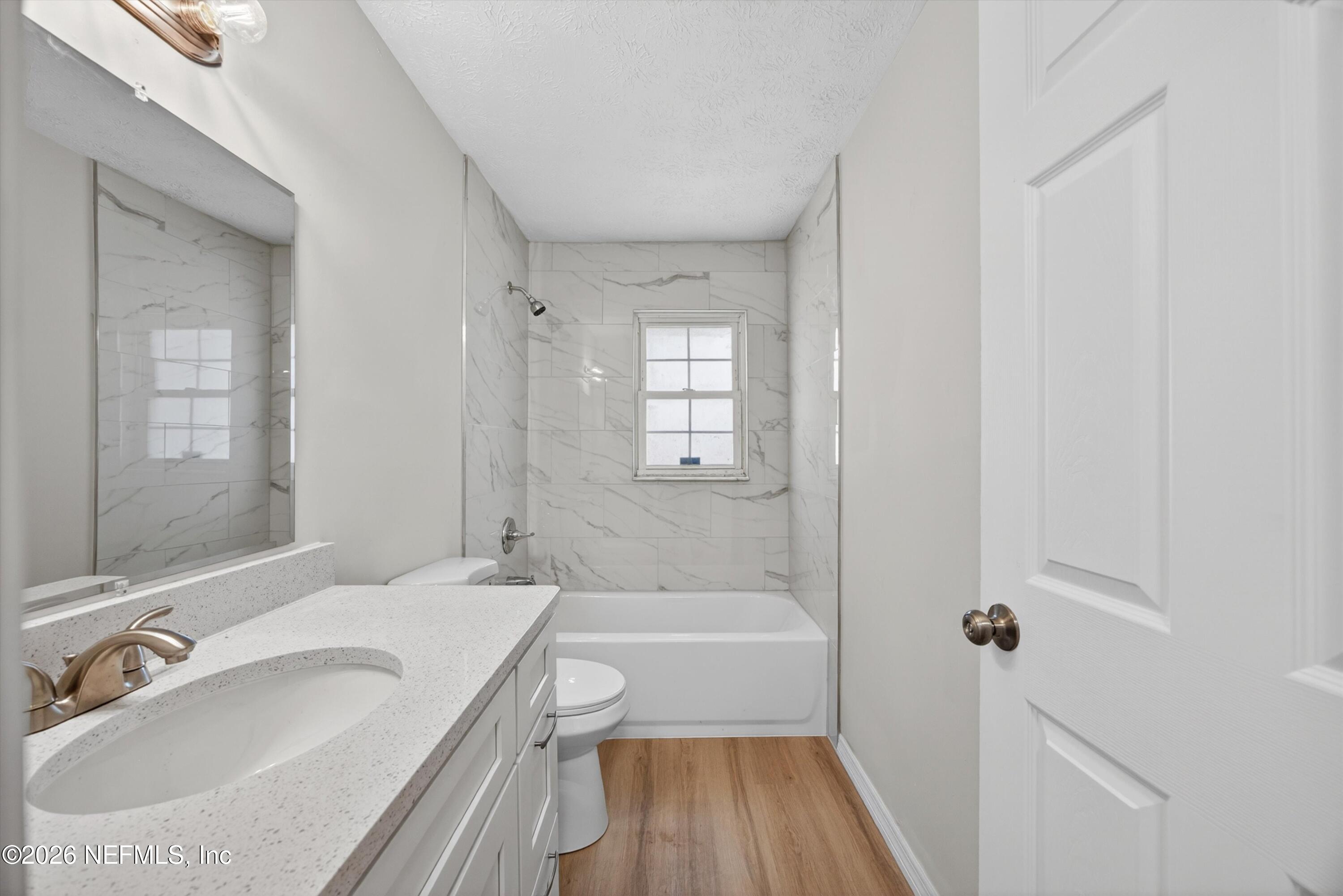 6894 Ridge Street Keystone Heights, FL 32656 - Photo 29 of 40 a bathroom with a sink a toilet and shower