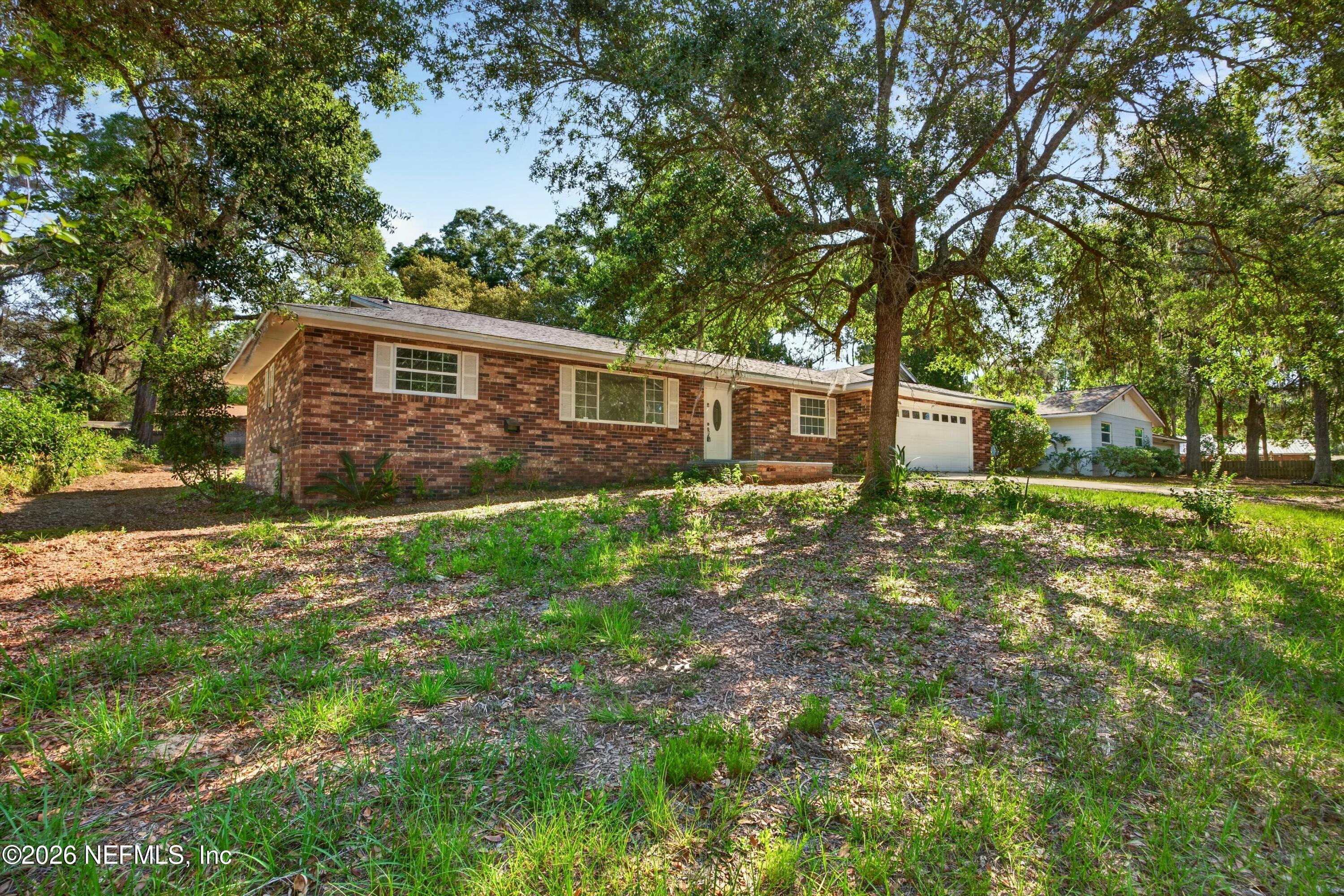 6894 Ridge Street Keystone Heights, FL 32656 - Photo 2 of 40 a front view of house with yard and green space