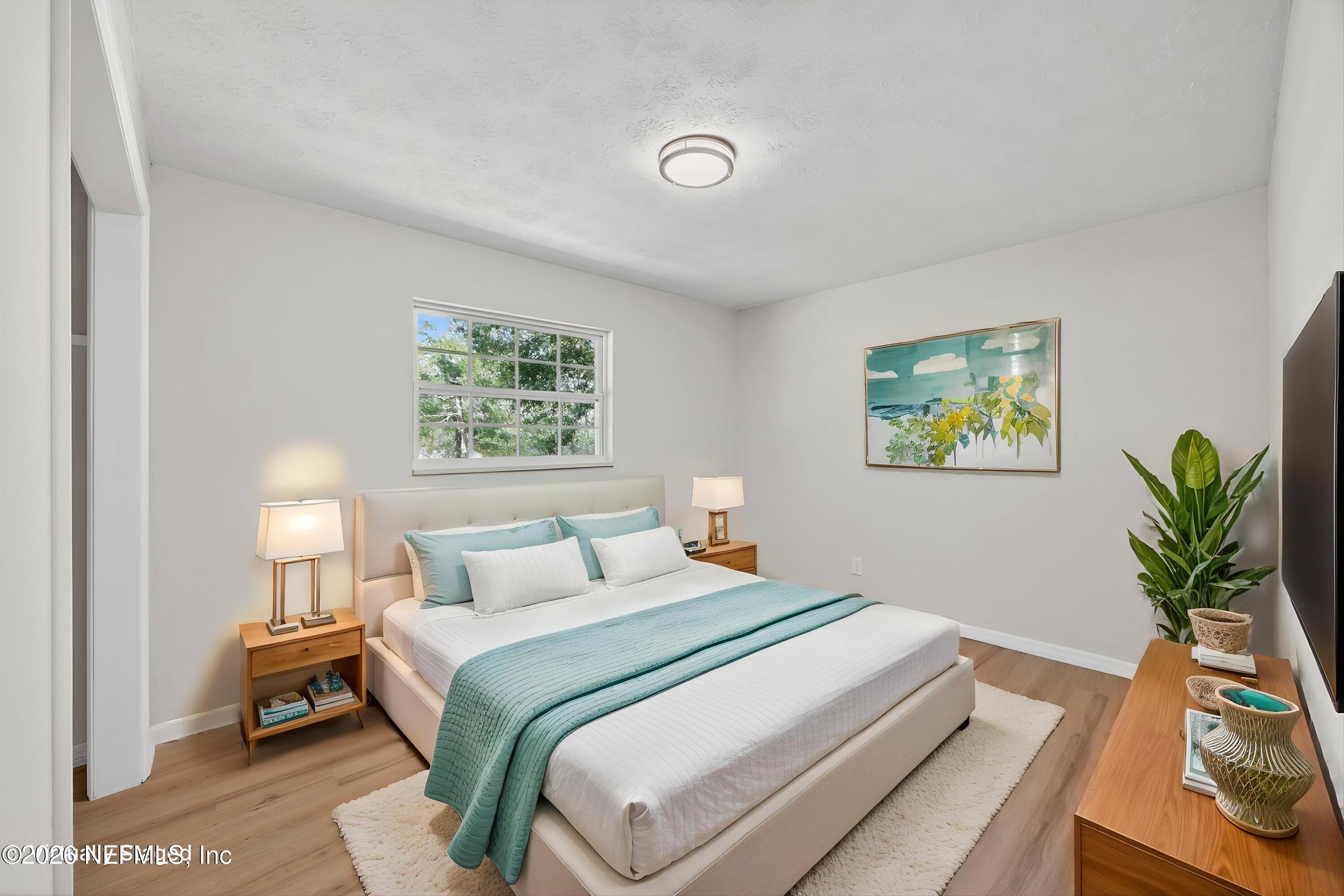 6894 Ridge Street Keystone Heights, FL 32656 - Photo 30 of 40 a bedroom with a bed and a window