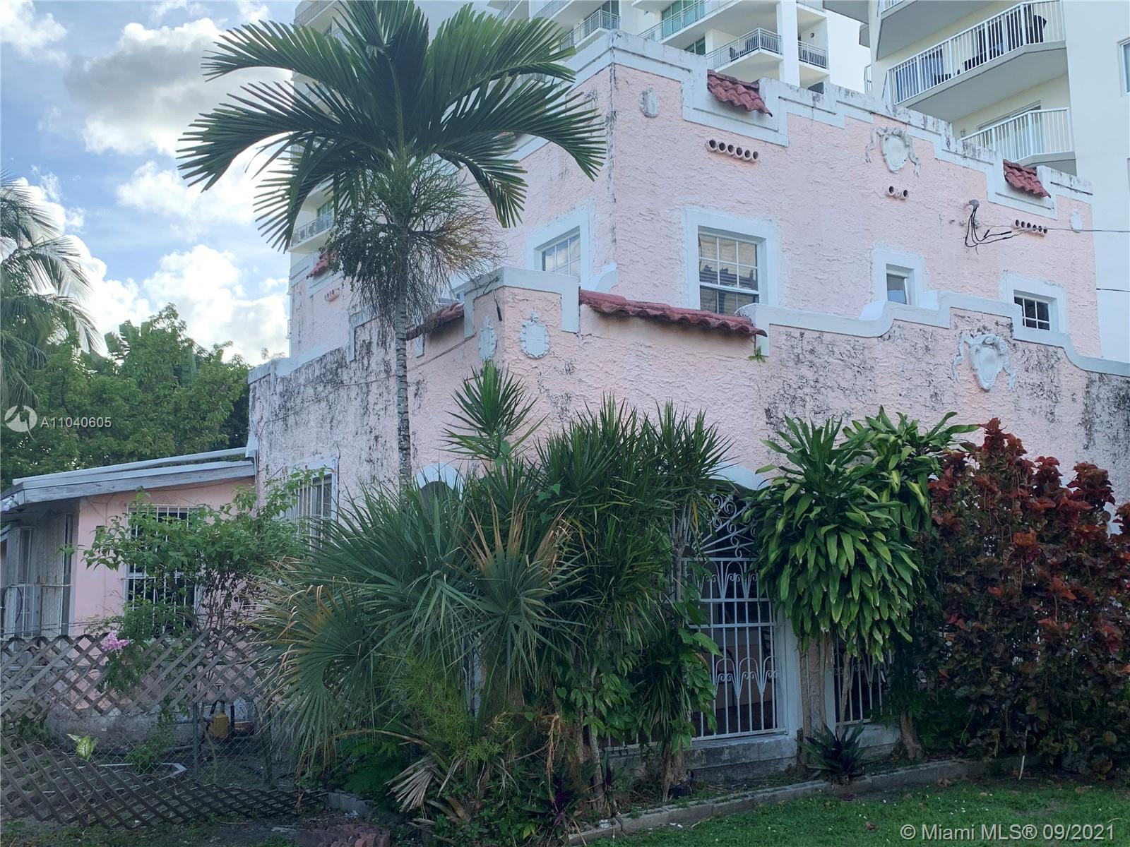 252 Southwest 20th Road Miami, FL 33129 - Photo 1 of 8 a view of a palm trees in front of a house