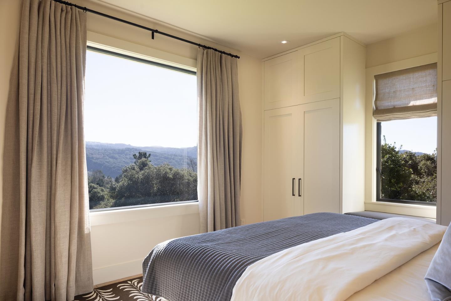 11 Alta Madera Carmel, CA 93923 - Photo 15 of 24 a bedroom with a bed and a window