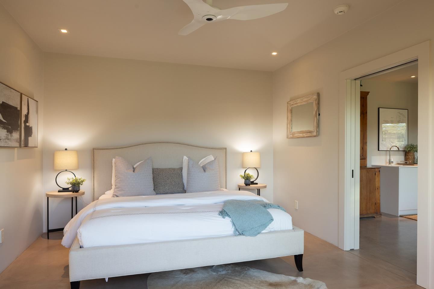 11 Alta Madera Carmel, CA 93923 - Photo 20 of 24 a bedroom with a bed and a lamp