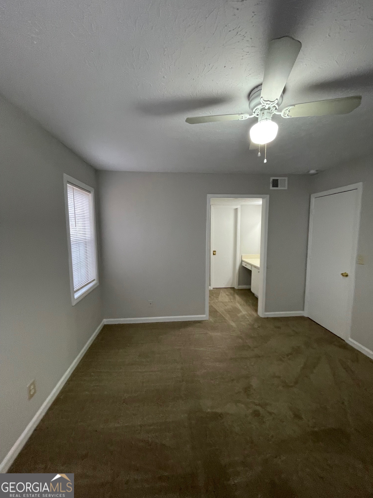 155 Bowen Street, Unit 9 Carrollton, GA 30117 - Photo 19 of 25 a view of an empty room with a window