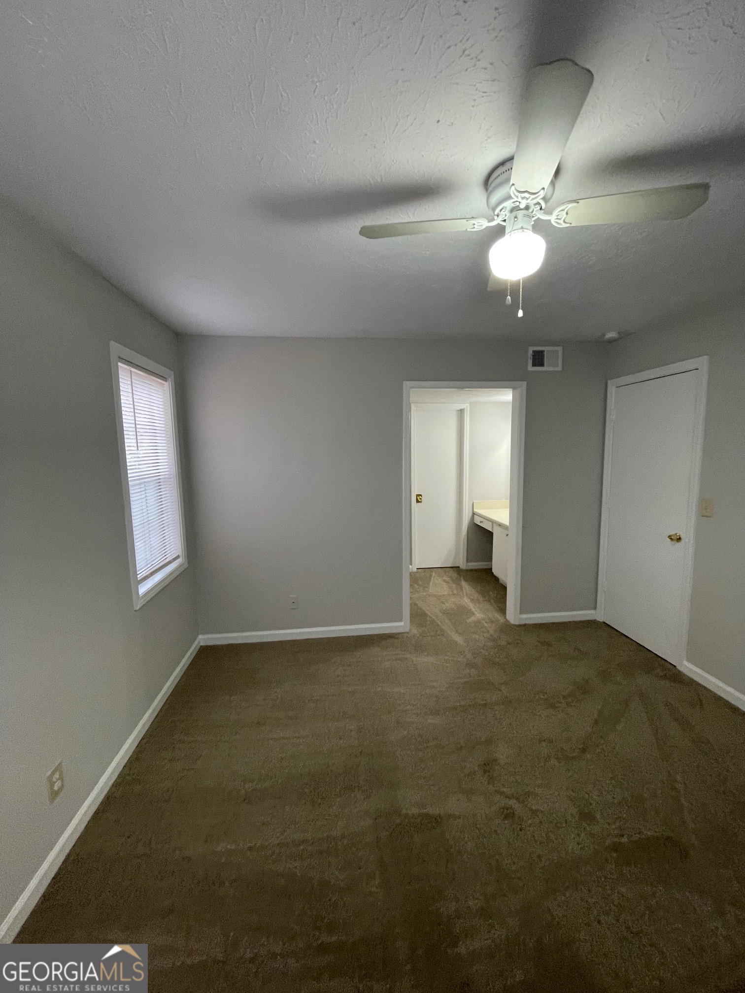 155 Bowen Street, Unit 9 Carrollton, GA 30117 - Photo 20 of 25 a view of an empty room with a window