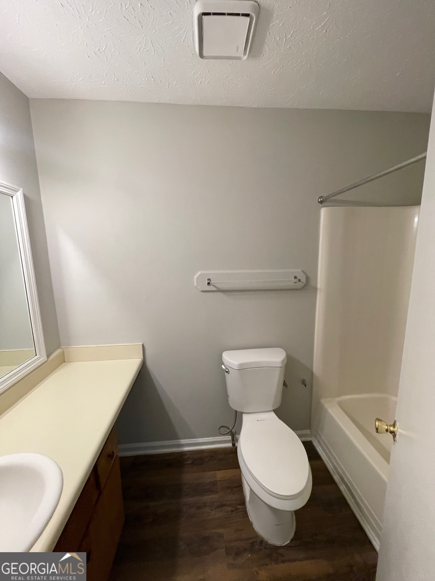 155 Bowen Street, Unit 9 Carrollton, GA 30117 - Photo 25 of 25 a bathroom with a toilet a sink and a bathtub