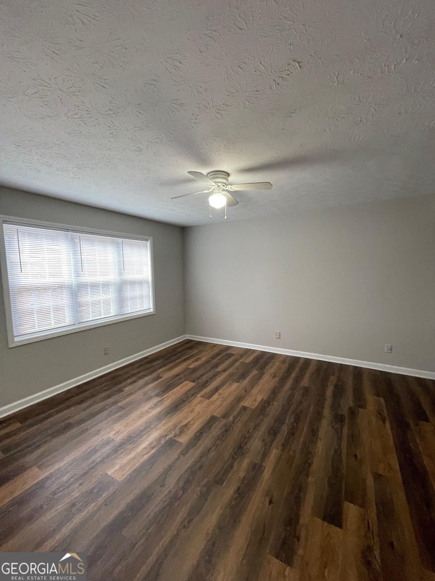 155 Bowen Street, Unit 9 Carrollton, GA 30117 - Photo 5 of 25 a view of an empty room and window