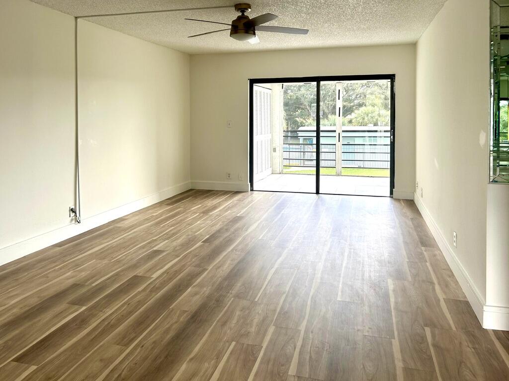 9370 Southwest 8th Street, Unit 202 Boca Raton, FL 33428 - Photo 14 of 46 a view of an empty room with a window
