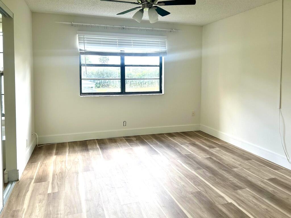 9370 Southwest 8th Street, Unit 202 Boca Raton, FL 33428 - Photo 16 of 46 an empty room with a window