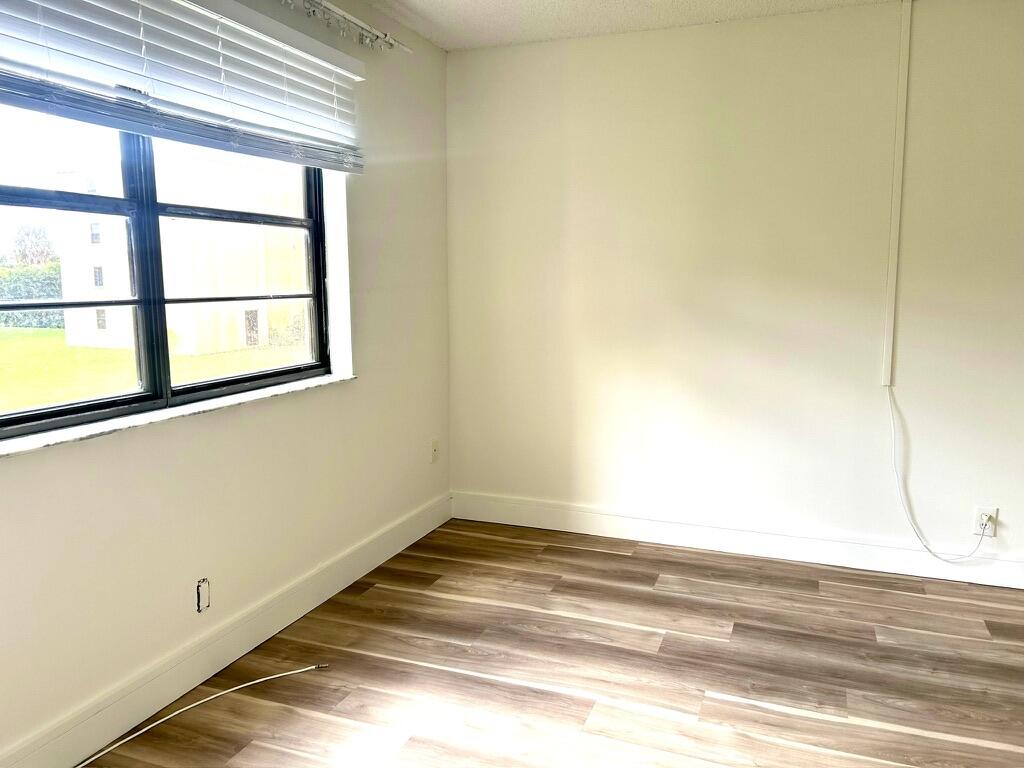 9370 Southwest 8th Street, Unit 202 Boca Raton, FL 33428 - Photo 20 of 46 a view of a room with a window