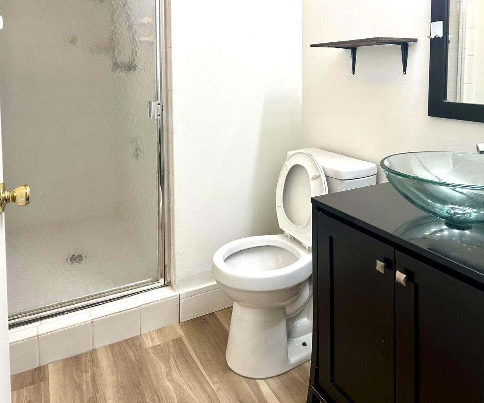 9370 Southwest 8th Street, Unit 202 Boca Raton, FL 33428 - Photo 26 of 46 a bathroom with a sink toilet and shower