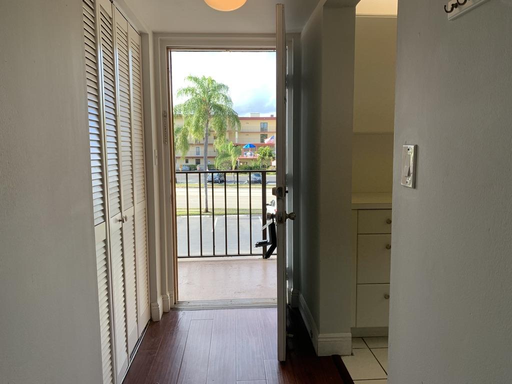 9370 Southwest 8th Street, Unit 202 Boca Raton, FL 33428 - Photo 3 of 46 a view of entryway with wooden floor