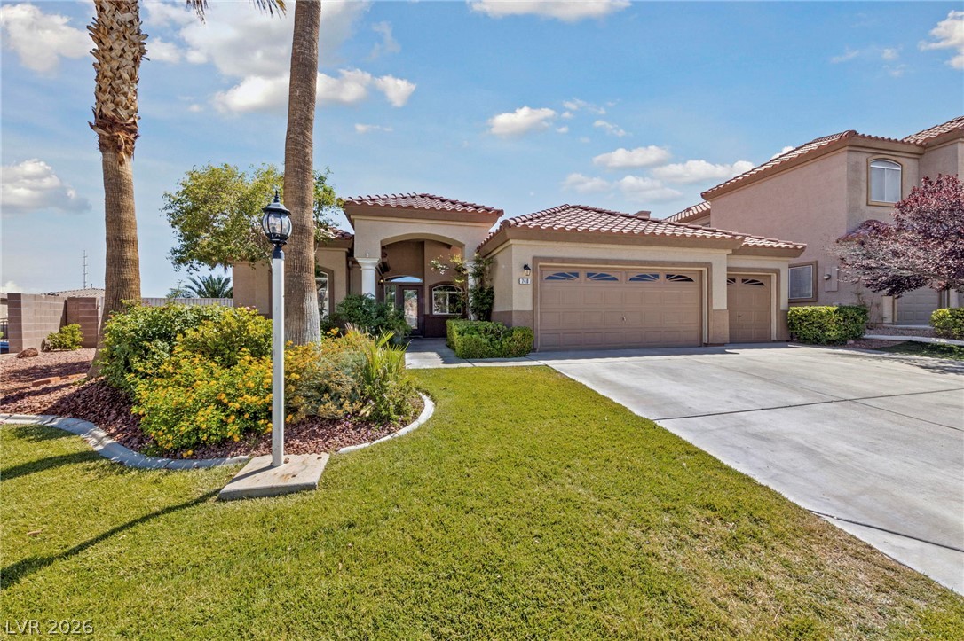 740 Aldo Rae Court, Unit NONE Henderson, NV 89052 - Photo 3 of 35 A well-maintained lawn and mature landscaping enhance this home's inviting curb appeal.