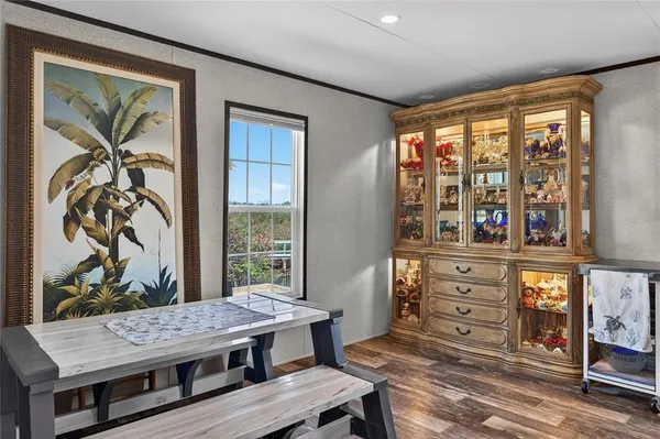 a view of a dining room with furniture window and outside view