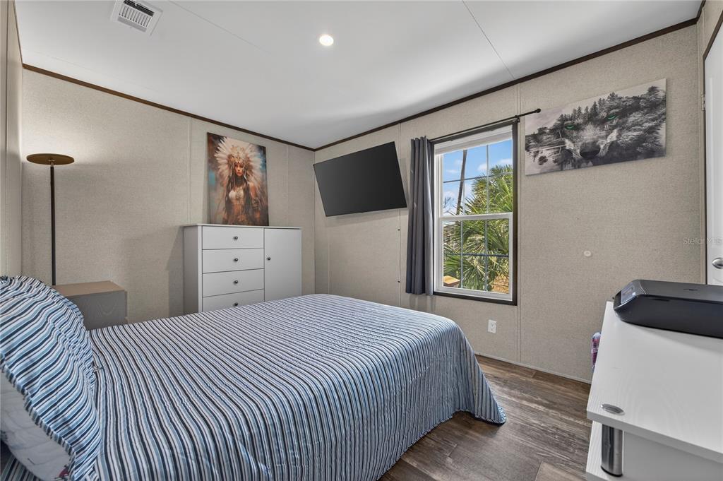 185 Coleman Street Edgewater, FL 32141 - Photo 27 of 47 a bedroom with a bed and a window