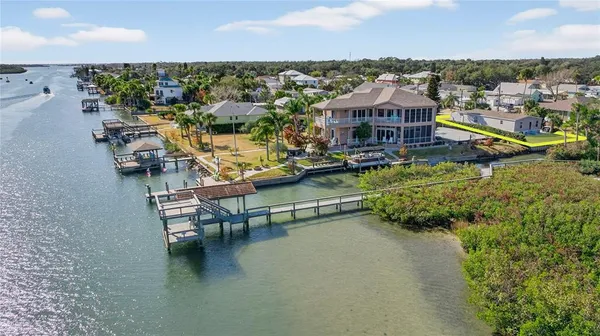 an aerial view of a house with a ocean view