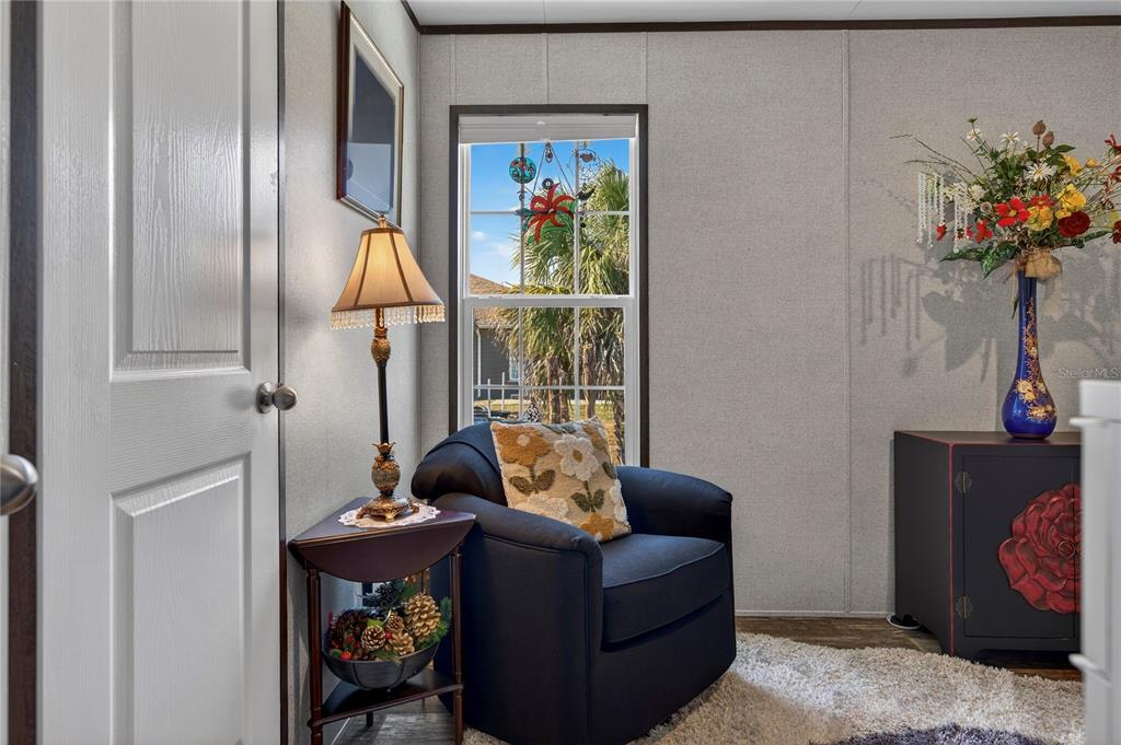 185 Coleman Street Edgewater, FL 32141 - Photo 33 of 47 a living room with furniture flowerpot and a potted plant