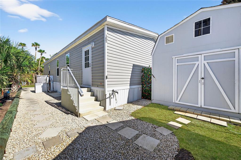 185 Coleman Street Edgewater, FL 32141 - Photo 38 of 47 a view of a house with backyard and a tree