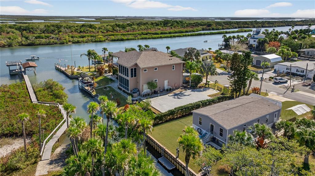 185 Coleman Street Edgewater, FL 32141 - Photo 40 of 47 an aerial view of a house with a lake view