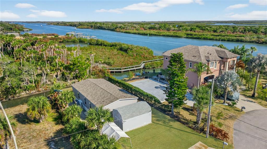 185 Coleman Street Edgewater, FL 32141 - Photo 46 of 47 an aerial view of a house with outdoor space and lake view